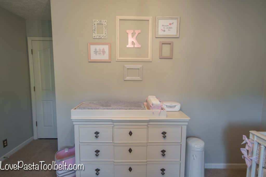 A gallery wall is a great way to dress up a blank wall. We created a gallery wall for K's nursery and I'm sharing Easy Steps to Create a Nursery Gallery Wall. #ad #GooGone #GoodAsGone