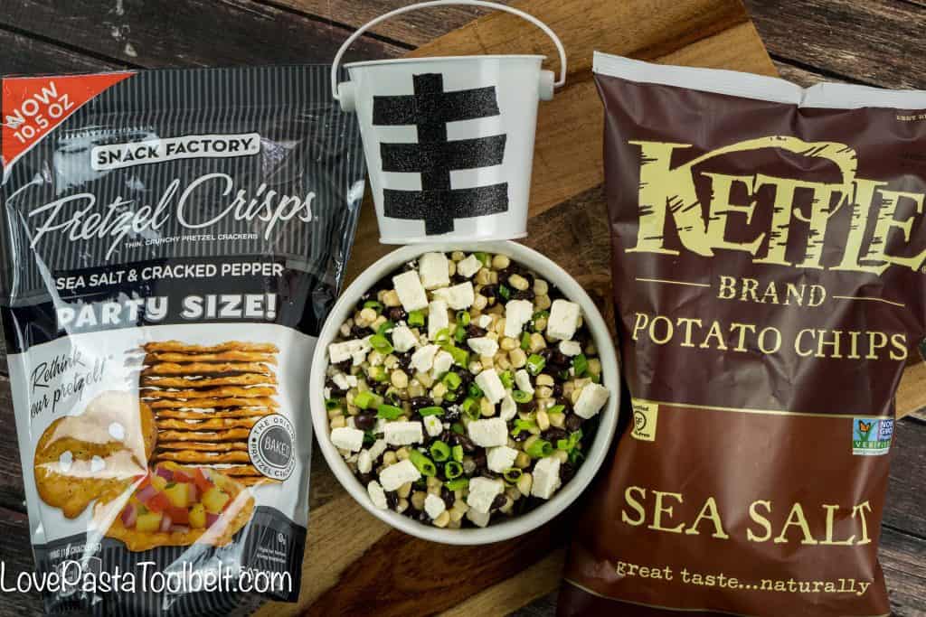 Football season is in full gear and hosting can be stressful. Take some of the stress out with this simple Black Bean Salsa and cute Football Themed Snack Pails for your next party!