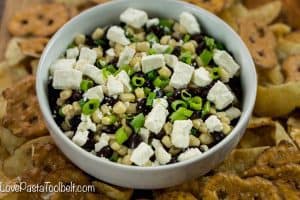 Football season is in full gear and hosting can be stressful. Take some of the stress out with this simple Black Bean Salsa and cute Football Themed Snack Pails for your next party!