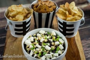 Football season is in full gear and hosting can be stressful. Take some of the stress out with this simple Black Bean Salsa and cute Football Themed Snack Pails for your next party!