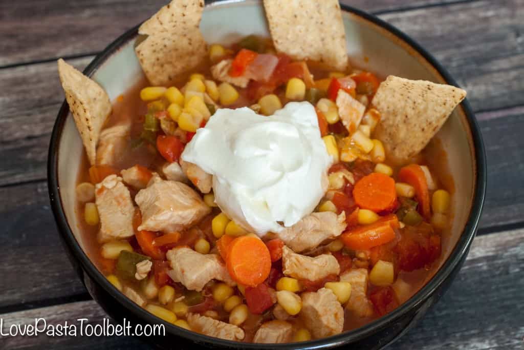 Loaded with vegetables and flavor this Chicken Tortilla Soup is the perfect warm meal!- Love, Pasta and a Tool Belt | recipes | food | soup recipes | chicken recipe | comfort food | 