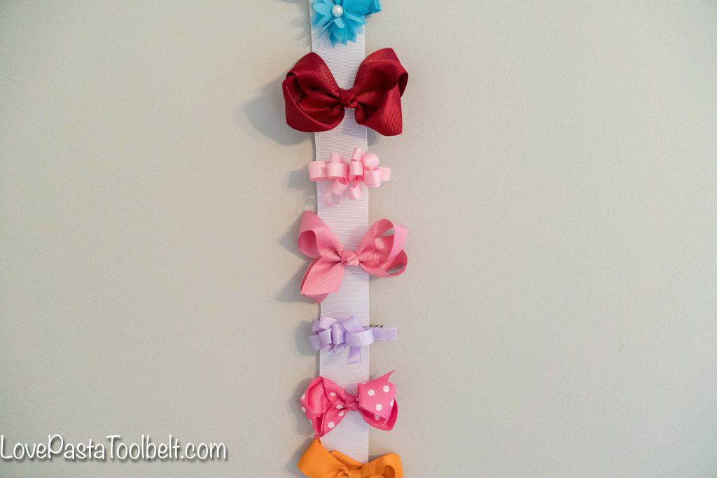 Create a cute and functional way to display your little girl's bows with this DIY Bow Holder