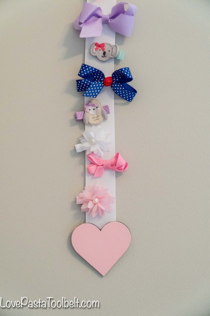 Create a cute and functional way to display your little girl's bows with this DIY Bow Holder