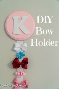 Create a cute and functional way to display your little girl's bows with this DIY Bow Holder from Love, Pasta and a Tool Belt