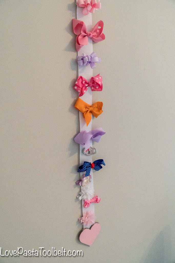 Create a cute and functional way to display your little girl's bows with this DIY Bow Holder