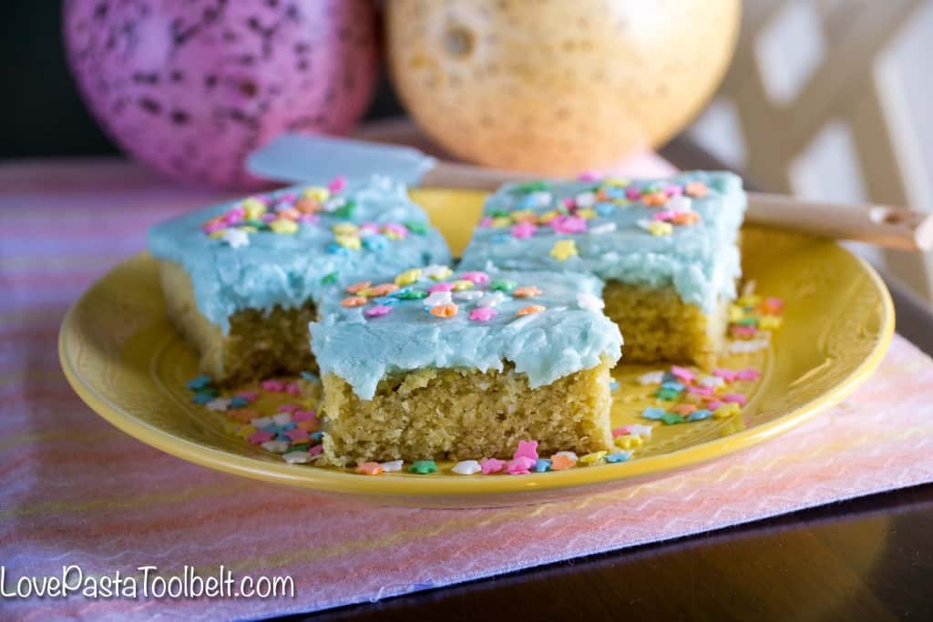Thick, delicious and covered in frosting, these Sugar Cookie Bars will be your new favorite dessert!- Love, Pasta and a Tool Belt | desserts | Easter | dessert recipes | sweets | 