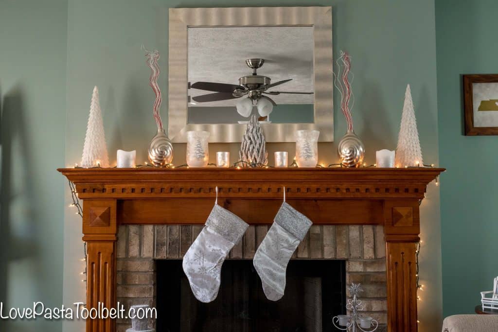 Get started on your Christmas decorating with this Silver and White Christmas Mantle Inspiration 